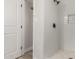 Bathroom featuring a white-tiled shower with matte black hardware and fixtures at 1413 E Dobbins Rd, Phoenix, AZ 85042