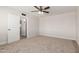 Bedroom with carpet, ceiling fan, and doorway to another room at 1413 E Dobbins Rd, Phoenix, AZ 85042