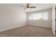 Neutral bedroom showcasing carpet floors and a ceiling fan for added comfort at 1413 E Dobbins Rd, Phoenix, AZ 85042
