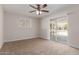 Bedroom with carpet, sliding glass doors to the backyard, and ceiling fan with lighting at 1413 E Dobbins Rd, Phoenix, AZ 85042