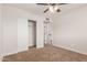 Bedroom featuring carpet, ceiling fan, closet with sliding doors, and entry to another room at 1413 E Dobbins Rd, Phoenix, AZ 85042