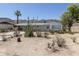 Charming single-story home featuring desert landscaping and a covered carport at 1413 E Dobbins Rd, Phoenix, AZ 85042