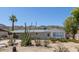 Charming single-story home featuring desert landscaping and a covered carport at 1413 E Dobbins Rd, Phoenix, AZ 85042