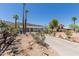 Image of a home surrounded by desert landscaping, palm trees, and mountain views at 1413 E Dobbins Rd, Phoenix, AZ 85042