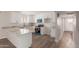 Bright kitchen with stainless steel appliances, white cabinetry, and granite countertops at 1413 E Dobbins Rd, Phoenix, AZ 85042