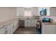 Bright kitchen featuring white cabinets, stainless appliances and granite counters at 1413 E Dobbins Rd, Phoenix, AZ 85042