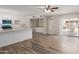 Open-concept layout showcasing a modern kitchen with an island and a spacious living area at 1413 E Dobbins Rd, Phoenix, AZ 85042