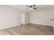 Spacious living room featuring wood-look flooring and a modern ceiling fan at 1413 E Dobbins Rd, Phoenix, AZ 85042