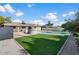 Backyard with a swimming pool, patio, and an outdoor kitchen at 1421 W Pasadena Ave, Phoenix, AZ 85013