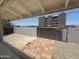 View of an enclosed backyard with a wall and metal gate at 1421 W Pasadena Ave, Phoenix, AZ 85013