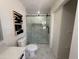 Modern bathroom with glass-enclosed shower and updated fixtures, blending style and functionality at 1421 W Pasadena Ave, Phoenix, AZ 85013