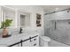 Modern bathroom with sleek vanity, illuminated mirror and frameless glass shower at 1421 W Pasadena Ave, Phoenix, AZ 85013