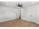 Light and airy bedroom with wood floors and modern ceiling fan at 1421 W Pasadena Ave, Phoenix, AZ 85013