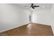 This is a room that features wood floors, a ceiling fan and a window for natural light at 1421 W Pasadena Ave, Phoenix, AZ 85013