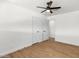 Light and airy bedroom with wood floors, a ceiling fan, and two interior doors at 1421 W Pasadena Ave, Phoenix, AZ 85013