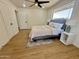 Relaxing bedroom with a ceiling fan, natural light, and a stylish rug at 1421 W Pasadena Ave, Phoenix, AZ 85013