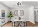 Charming dining area featuring a modern light fixture and artwork, creating a welcoming space for meals at 1421 W Pasadena Ave, Phoenix, AZ 85013