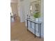 Stylish entryway featuring a marble console table with decorative mirror, candles, and greenery, adding elegance at 1421 W Pasadena Ave, Phoenix, AZ 85013