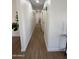 Hallway features updated floors, neutral paint and trim, and leads to various rooms at 1421 W Pasadena Ave, Phoenix, AZ 85013