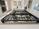 Modern gas range cooktop installed on island with white countertops in a bright, open kitchen at 1421 W Pasadena Ave, Phoenix, AZ 85013