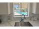 Kitchen sink with view of a sparkling pool and backyard, bringing natural light and outdoor charm at 1421 W Pasadena Ave, Phoenix, AZ 85013