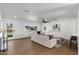 Bright living room with hardwood floors and white walls, showcasing an open layout and lots of natural light at 1421 W Pasadena Ave, Phoenix, AZ 85013