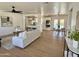 Spacious living room with an open floor plan connecting to the dining area, pool view, and modern kitchen at 1421 W Pasadena Ave, Phoenix, AZ 85013