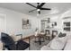 Cozy living area showcases an open concept with hardwood floors and seamless flow into an updated kitchen at 1421 W Pasadena Ave, Phoenix, AZ 85013