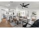 Bright and airy living room with hardwood floors, stylish decor, and a view into the modern, eat-in kitchen at 1421 W Pasadena Ave, Phoenix, AZ 85013