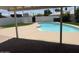 Backyard view of swimming pool surrounded by a patio and well-maintained lawn at 1421 W Pasadena Ave, Phoenix, AZ 85013