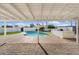 Covered patio offers view of pool with an outdoor kitchen at 1421 W Pasadena Ave, Phoenix, AZ 85013
