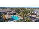 An aerial view shows the community pool, clubhouse, and lush landscaping at 15221 N Clubgate Dr # 2096, Scottsdale, AZ 85254