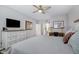 Bedroom features a bed, dresser, and television at 15221 N Clubgate Dr # 2096, Scottsdale, AZ 85254