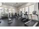 Brightly lit community gym with many machines and free weights at 15221 N Clubgate Dr # 2096, Scottsdale, AZ 85254