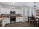 Well-lit kitchen featuring white cabinets and stainless steel appliances at 15221 N Clubgate Dr # 2096, Scottsdale, AZ 85254