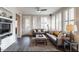Open-concept living room features a fireplace, built-in shelving, and large windows at 15221 N Clubgate Dr # 2096, Scottsdale, AZ 85254