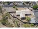 Aerial view of a home with a large lot surrounded by a privacy wall at 1530 E Loma Ln, Phoenix, AZ 85020