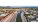 Impressive aerial view of the canal, nestled between residential communities, with mountain views at 1530 E Loma Ln, Phoenix, AZ 85020