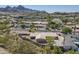 Scenic aerial view of a residential neighborhood featuring mountain views and beautiful landscaping at 1530 E Loma Ln, Phoenix, AZ 85020