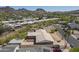 Expansive aerial view of a desert community with mountain views and lush landscaping at 1530 E Loma Ln, Phoenix, AZ 85020