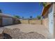 View of backyard featuring concrete patio area connecting house and detached garage at 1530 E Loma Ln, Phoenix, AZ 85020