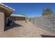This backyard has mature landscaping, decorative gravel and a brick pathway at 1530 E Loma Ln, Phoenix, AZ 85020