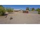 Exterior side yard with gravel and a large gate at 1530 E Loma Ln, Phoenix, AZ 85020