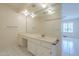 Bathroom featuring a vanity with a large mirror and ample counter space at 1530 E Loma Ln, Phoenix, AZ 85020