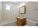 Bathroom featuring a bathtub, shower curtain, and vanity at 1530 E Loma Ln, Phoenix, AZ 85020