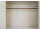 Empty closet with a rod for hanging clothes, ready for storage at 1530 E Loma Ln, Phoenix, AZ 85020