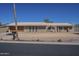 Charming single-story brick home with a desert landscape and a two-car garage at 1530 E Loma Ln, Phoenix, AZ 85020