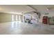 View of the spacious garage with a concrete floor and convenient access to another garage at 1530 E Loma Ln, Phoenix, AZ 85020