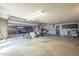 Large garage space offering ample storage and workspace with an open door at 1530 E Loma Ln, Phoenix, AZ 85020