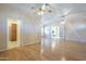 Spacious living room offering multiple access points and hardwood flooring at 1530 E Loma Ln, Phoenix, AZ 85020